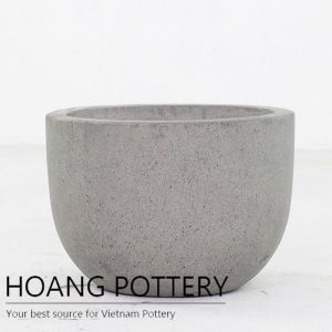 Raw concrete low round planters