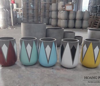 GEOMETRIC PATTERN PAINTED CEMENT PLANTERS CREATE ATTRACTIVE AND MODERN VIEWS IN INDOOR AND OUTDOOR DECORATION